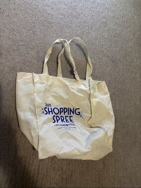 Destination D23 Cream Tote with Blue Shopping Spree Print